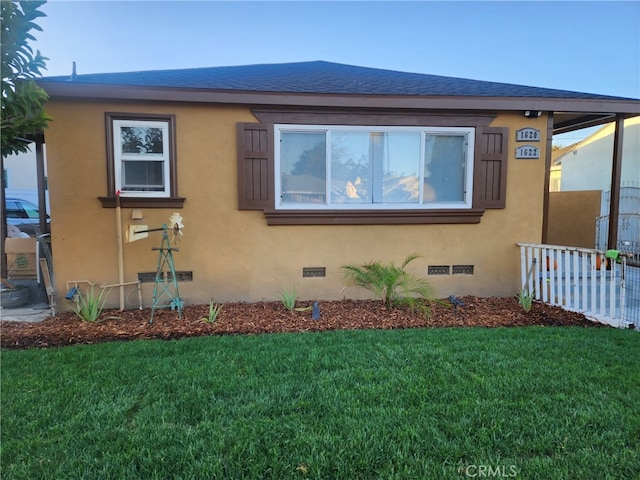 view of home's exterior with a yard