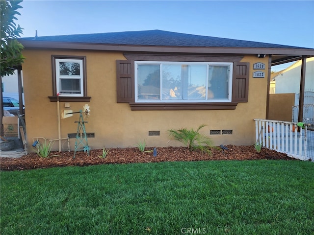 1620 E Mcmillan, Compton, CA 90221 - view of home's exterior featuring a lawn, stucco siding, and crawl space