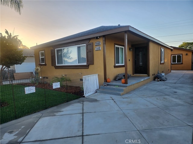 view of front of house with a yard