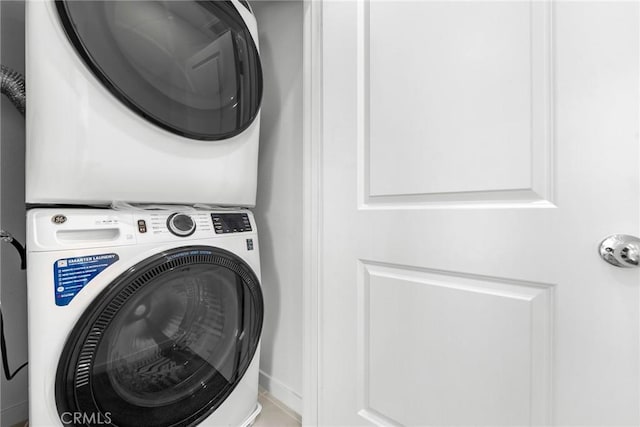 laundry room featuring stacked washer and dryer