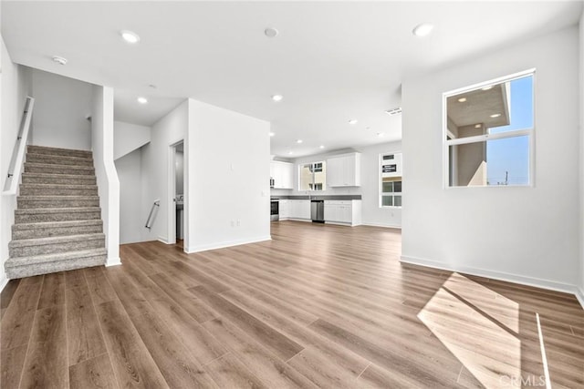 unfurnished living room with light hardwood / wood-style floors