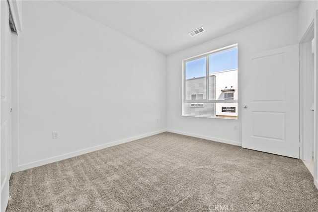 unfurnished room with carpet floors