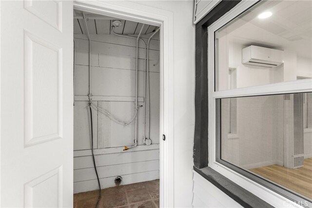 bathroom with a wall mounted air conditioner