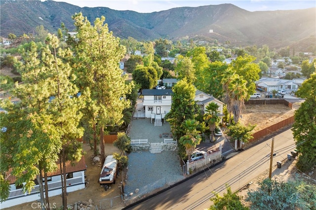 birds eye view of property with a mountain view