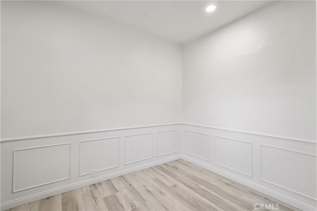 spare room with light hardwood / wood-style floors