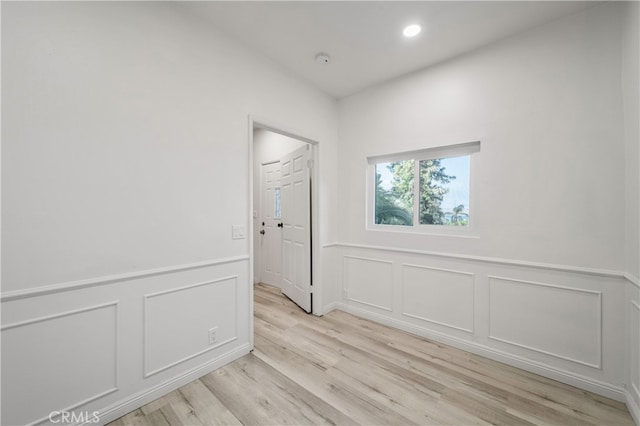 empty room with light hardwood / wood-style floors