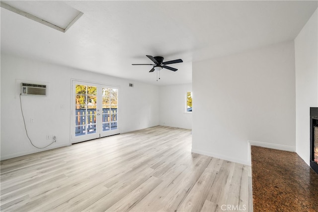 unfurnished living room with ceiling fan and light hardwood / wood-style flooring