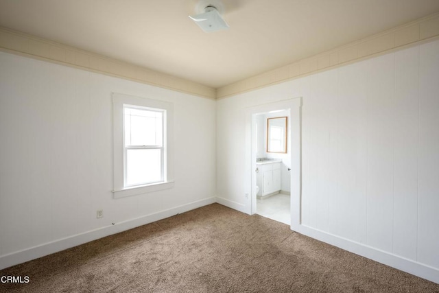 unfurnished room with carpet flooring