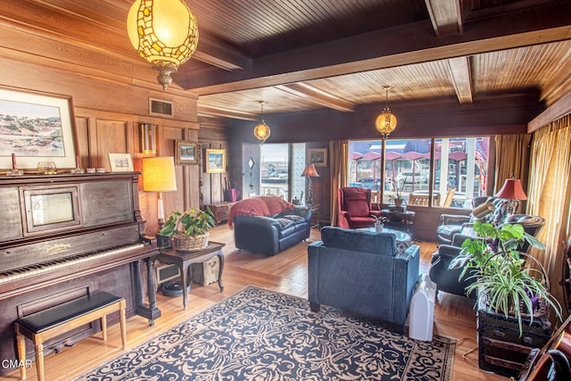 interior space featuring wooden ceiling, wooden walls, beamed ceiling, and hardwood / wood-style flooring