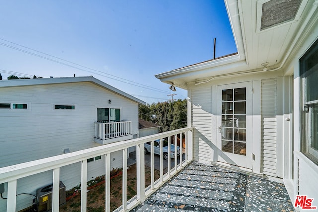 wooden deck with central AC unit