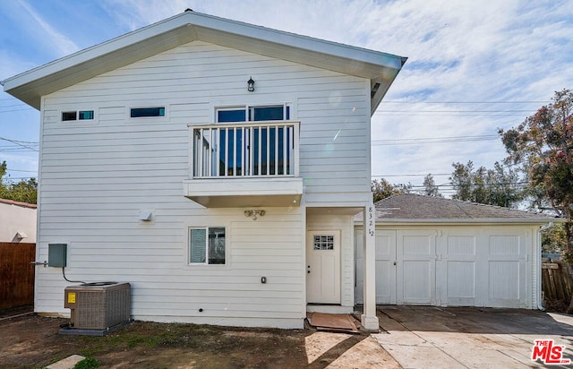 rear view of house with a balcony and central air condition unit