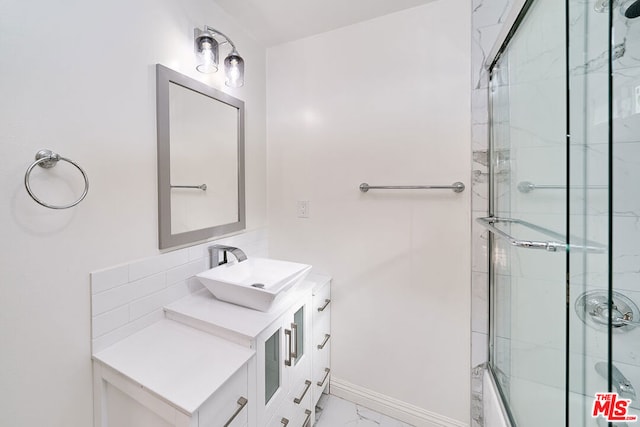 bathroom with vanity and enclosed tub / shower combo