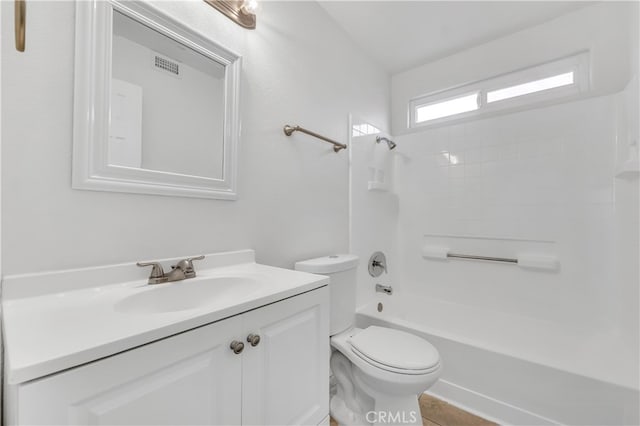 full bathroom featuring bathing tub / shower combination, vanity, and toilet