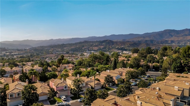 birds eye view of property featuring a mountain view