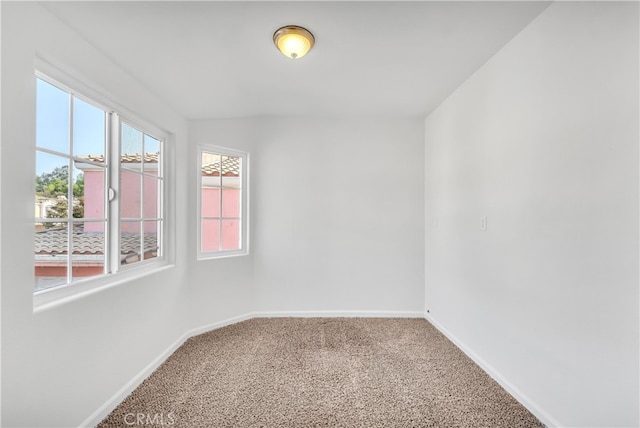 unfurnished room featuring carpet flooring