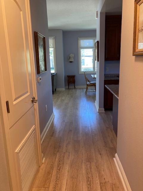 corridor featuring light hardwood / wood-style floors