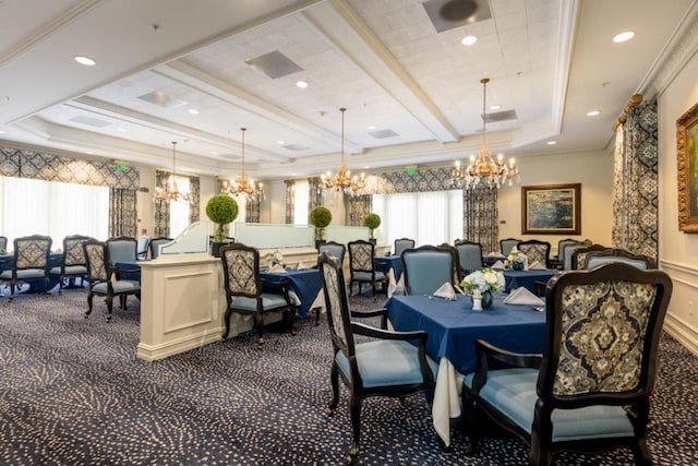 dining area with dark colored carpet, ornamental molding, a chandelier, and a tray ceiling