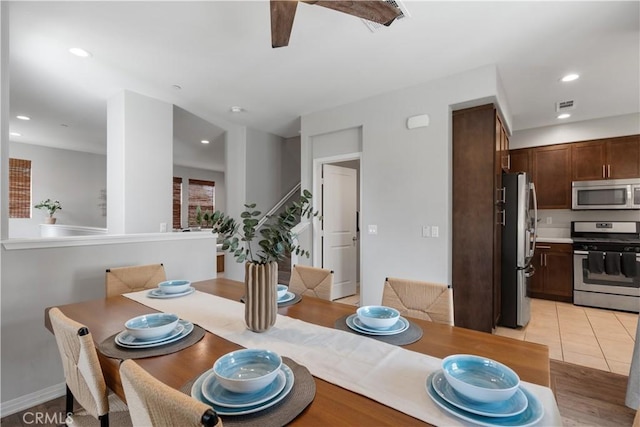 dining area with light tile patterned floors