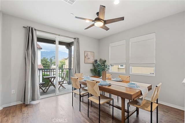 dining area featuring ceiling fan and hardwood / wood-style flooring