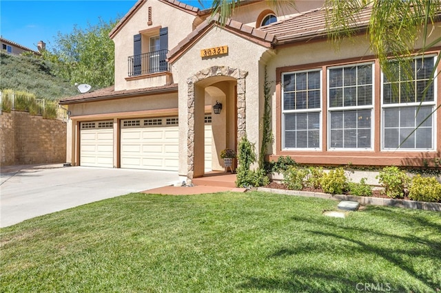 mediterranean / spanish-style home with a balcony, a front lawn, and a garage