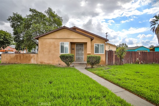 bungalow with a front lawn