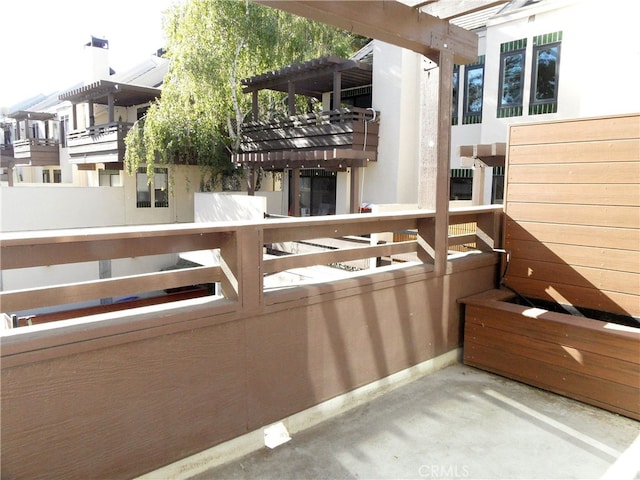 balcony featuring a pergola