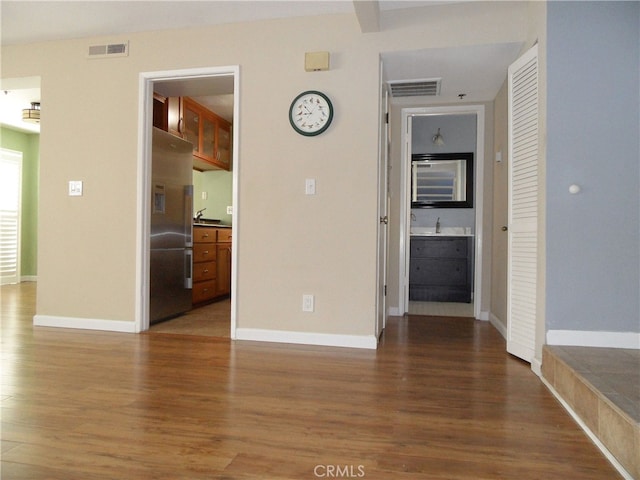 empty room with dark hardwood / wood-style flooring