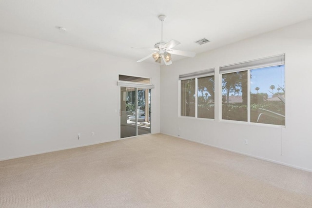 empty room featuring carpet flooring and ceiling fan