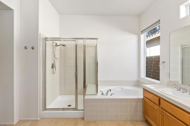 bathroom with vanity, plus walk in shower, and tile patterned floors