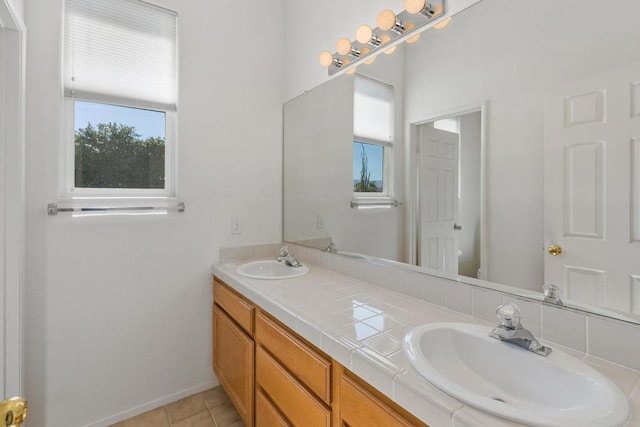 bathroom with tile patterned flooring, vanity, and toilet