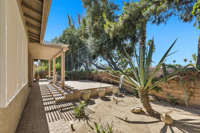 view of yard featuring a patio and a pergola