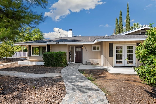 ranch-style home featuring french doors and a patio