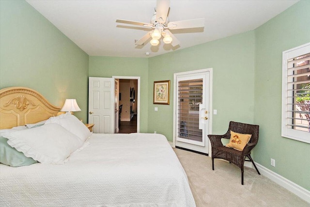 carpeted bedroom featuring access to outside and ceiling fan