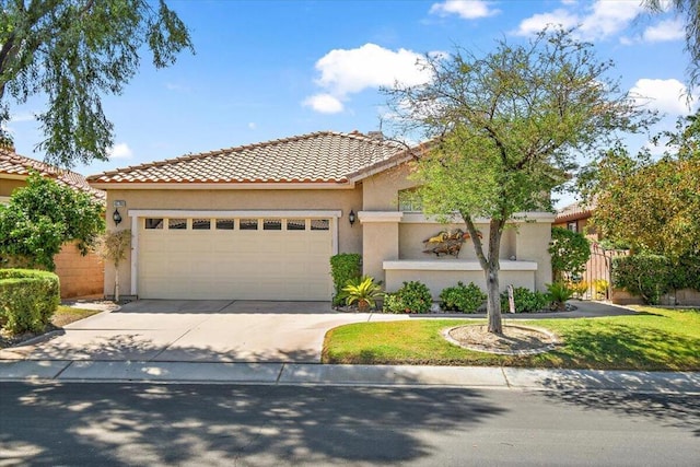 mediterranean / spanish home with a garage