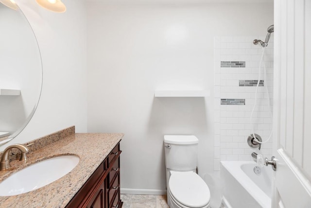 full bathroom featuring tiled shower / bath combo, vanity, and toilet