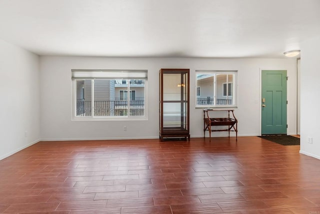 interior space featuring dark hardwood / wood-style floors and a healthy amount of sunlight