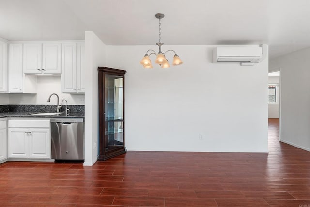 kitchen with white cabinetry, an AC wall unit, dishwasher, dark hardwood / wood-style flooring, and decorative light fixtures