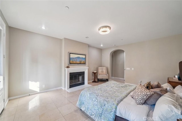 bedroom with light tile patterned floors