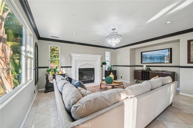 tiled living room featuring ornamental molding and a chandelier