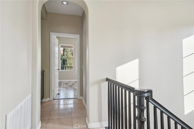 hallway with light tile patterned flooring