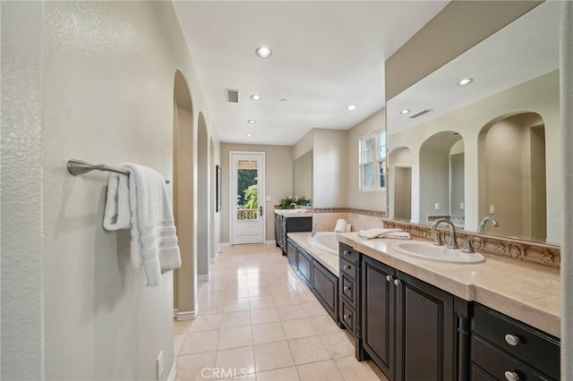 bathroom with vanity and tile patterned flooring