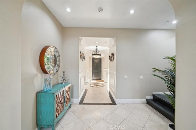 corridor featuring light tile patterned floors