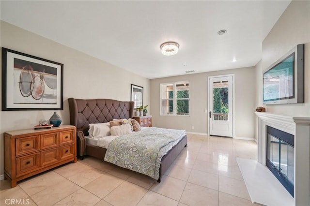 tiled bedroom featuring access to exterior