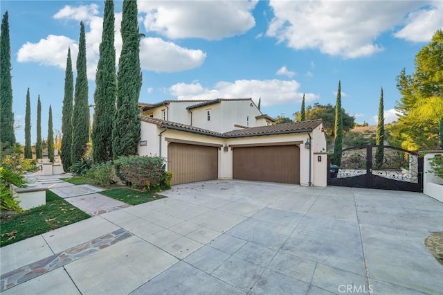 mediterranean / spanish-style home featuring a garage