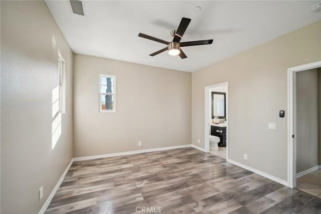 spare room featuring ceiling fan and wood-type flooring