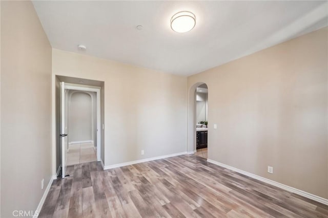 unfurnished room featuring wood-type flooring