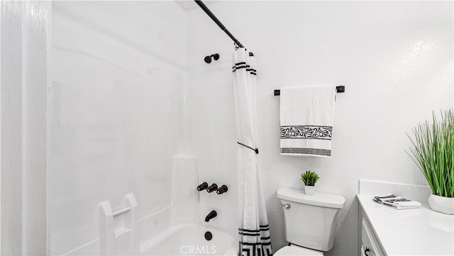 full bathroom with vanity, shower / tub combo, and toilet