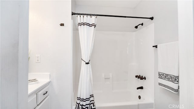 bathroom with shower / bath combination with curtain and vanity