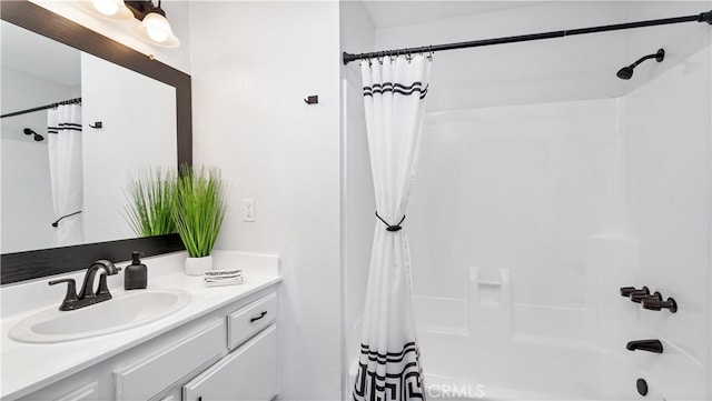 bathroom with vanity and shower / bath combo with shower curtain