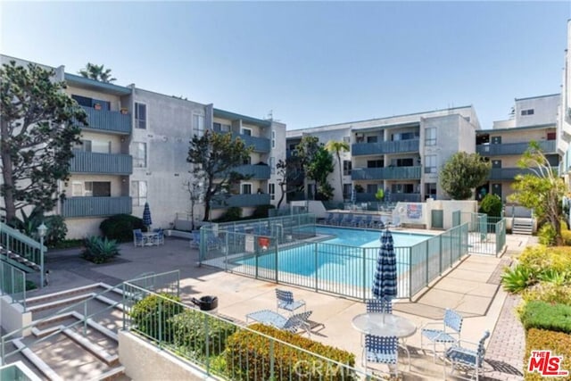 view of swimming pool with a patio area